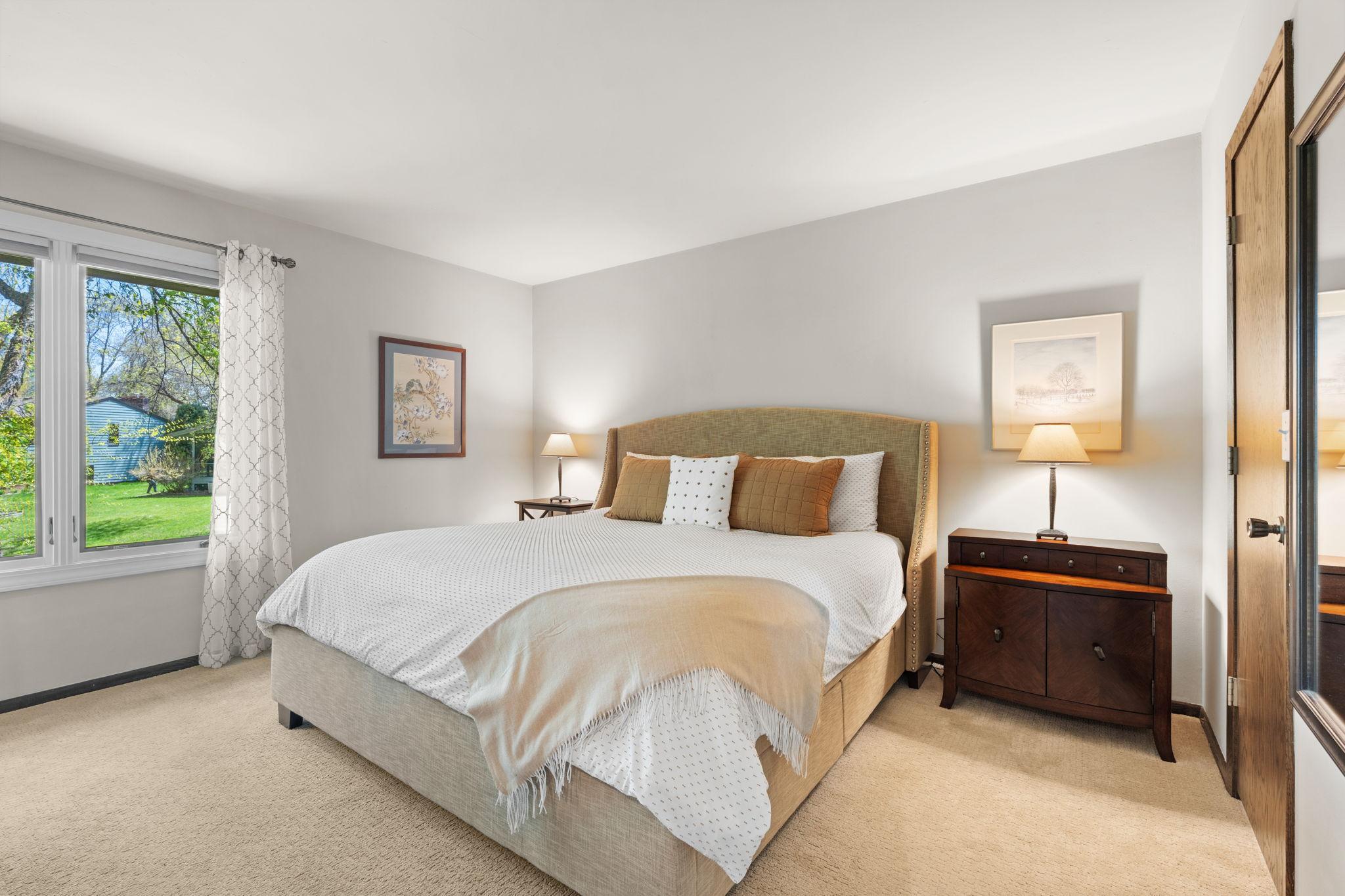 Make your way up to the primary suite. Private bath & walk in closet ensuite. All upper level windows replaced in 2020/2021 with darkening shades.