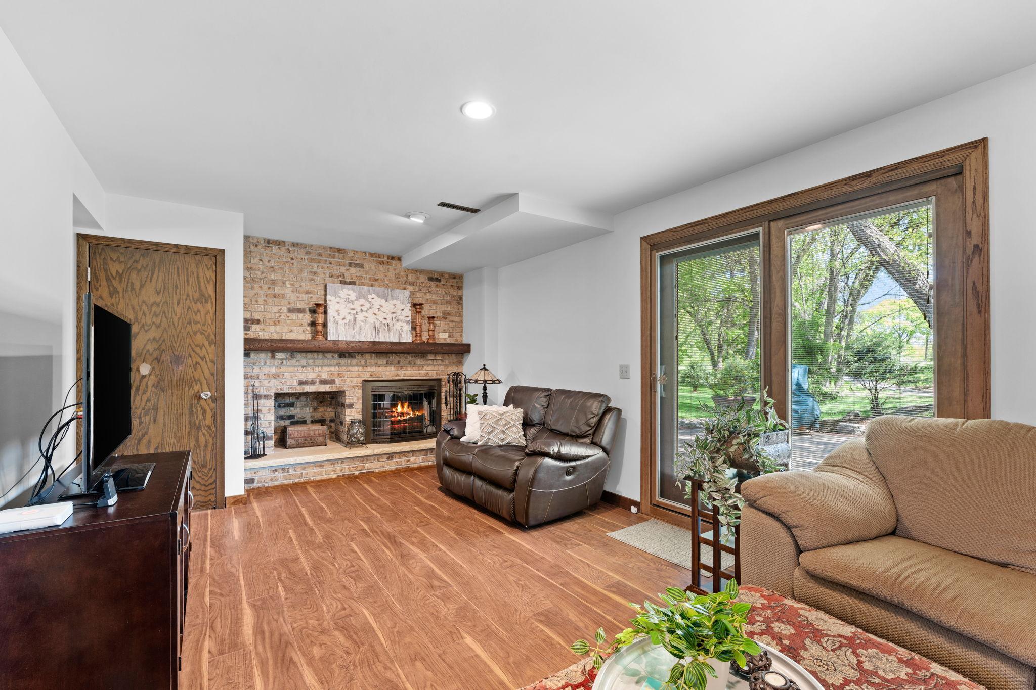 View of lower level family room with walk out to back patio & deck!