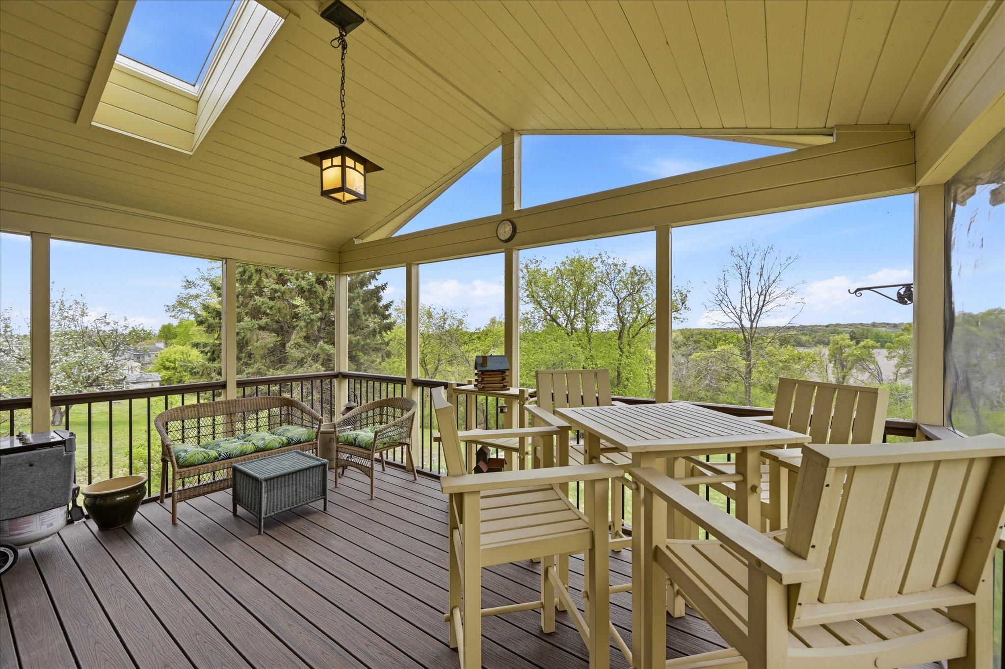 The vaulted screen porch has Trex composite decking and insulated ceiling and switched floor receptacles.