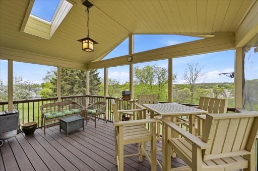 The vaulted screen porch has Trex composite decking and insulated ceiling and switched floor receptacles.