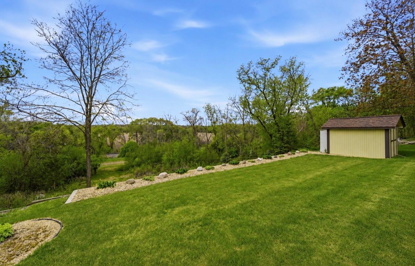 The well landscaped yard has power to the firepit area and shed and lighted landscape in both front and back. Lawn irrigation system which the seller has opened up and paid for the Fall blowout in advance.