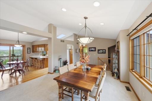 Vaulted ceiling throughout the full main level living with lovely light fixtures.