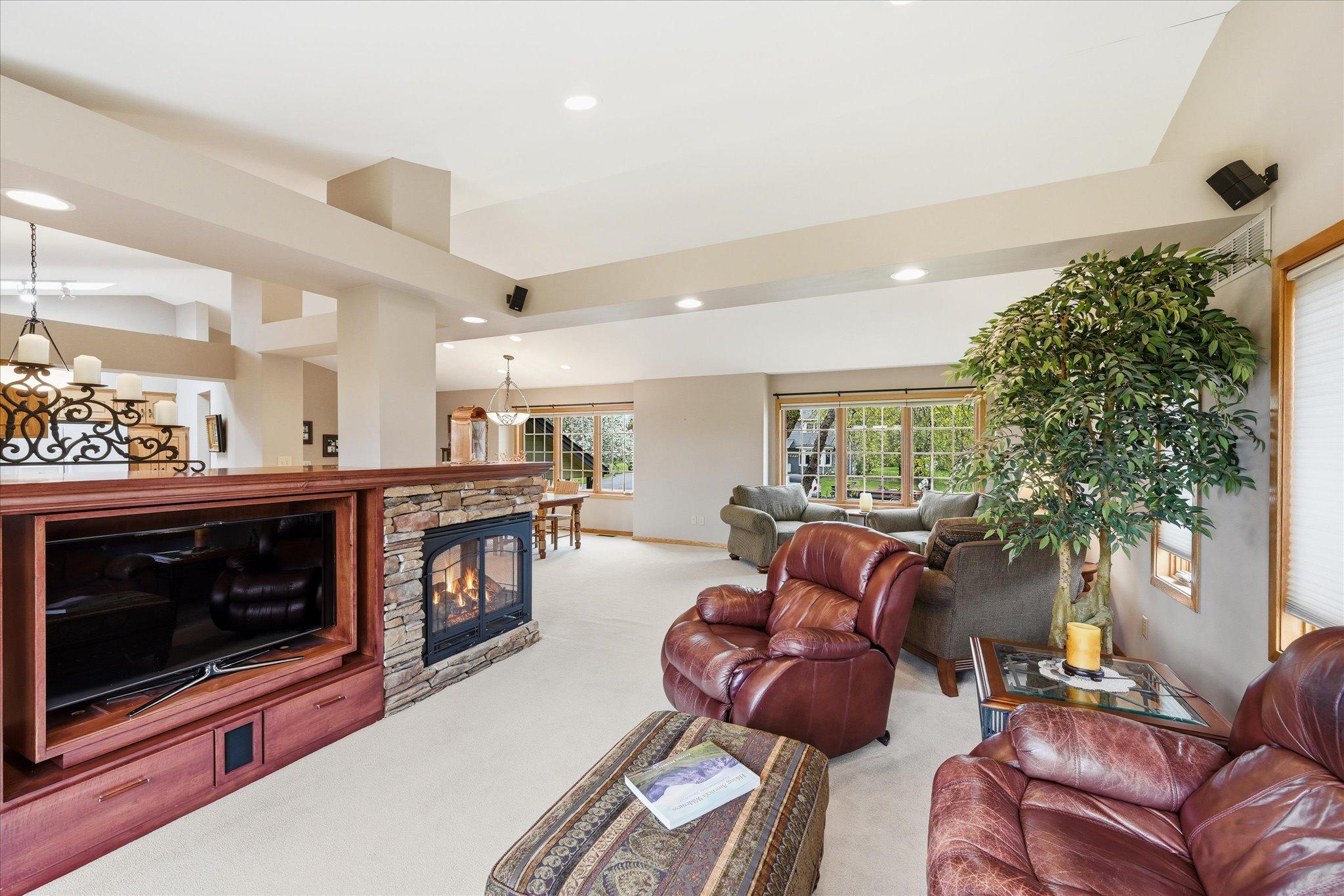 The artful design of the entertainment center allows the TV to spin from the hearth room to the dinette.