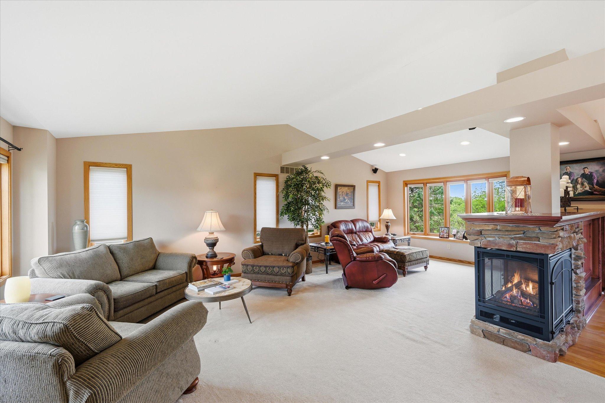 Currently used as living and hearth rooms, this great room flows together for multiple uses and furniture layout options.