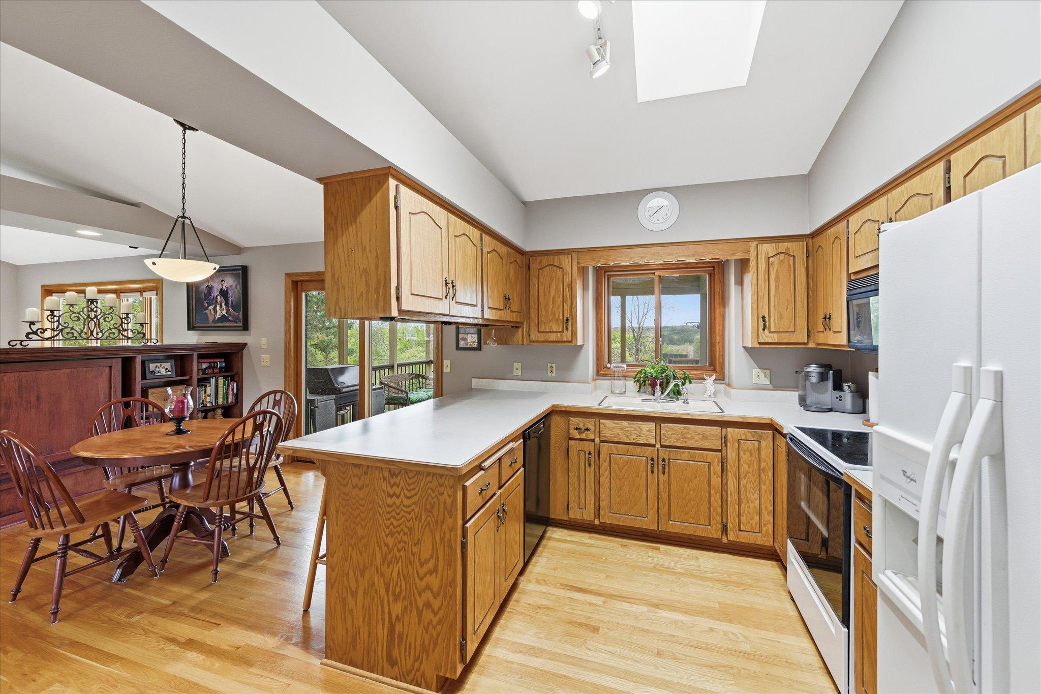 Oak hardwood floors in kitchen and dinette make this a warm rich space.