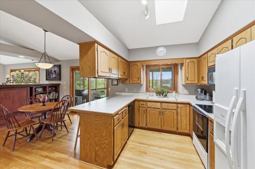 Oak hardwood floors in kitchen and dinette make this a warm rich space.