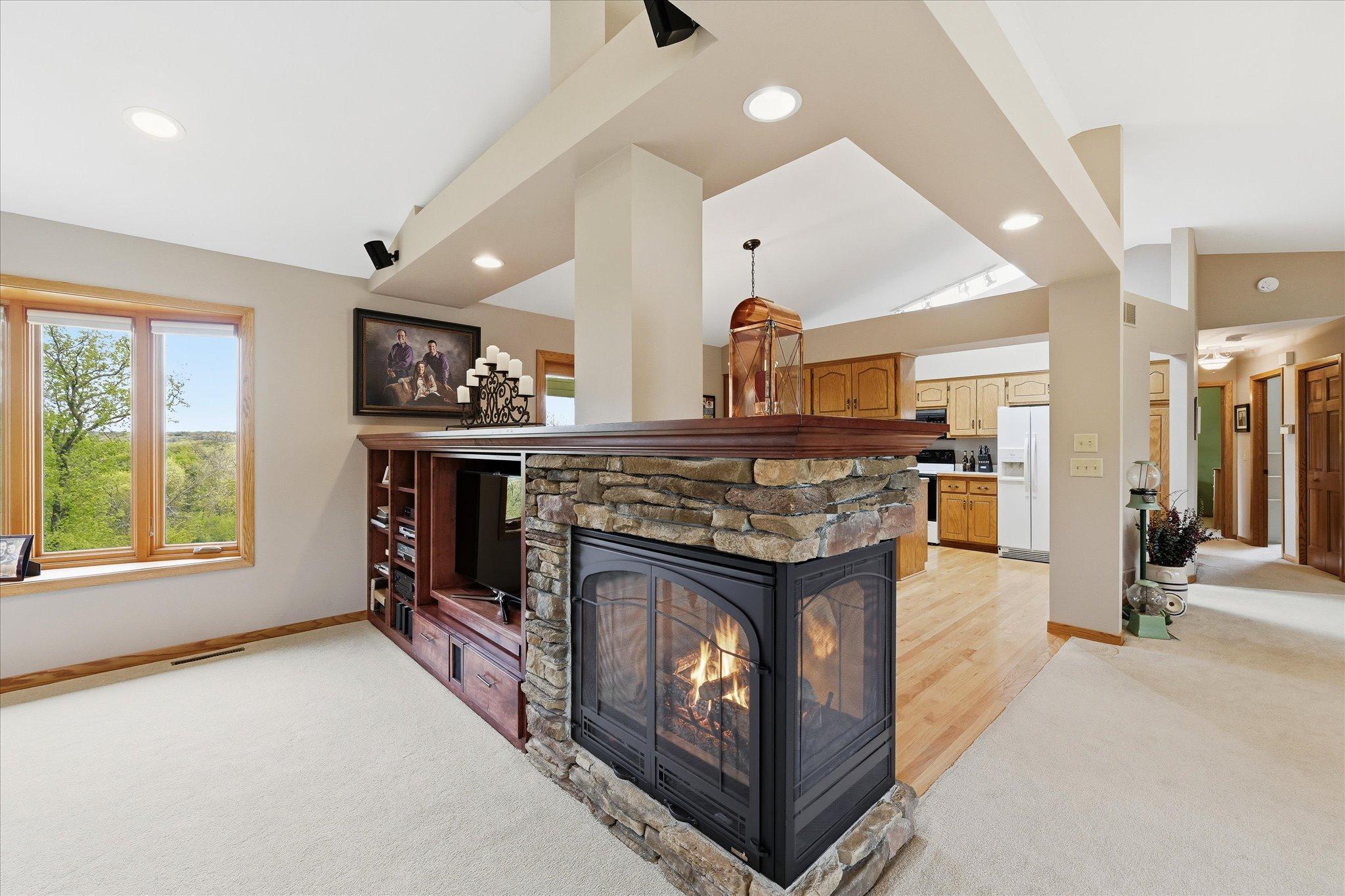 Upgraded 3 sided gas fireplace and entertainment media center.