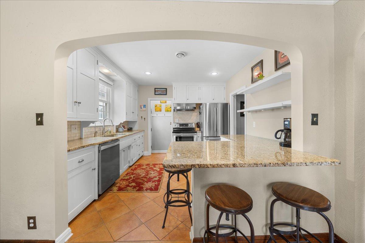 The window above the sink has been replaced with Anderson Renewal.