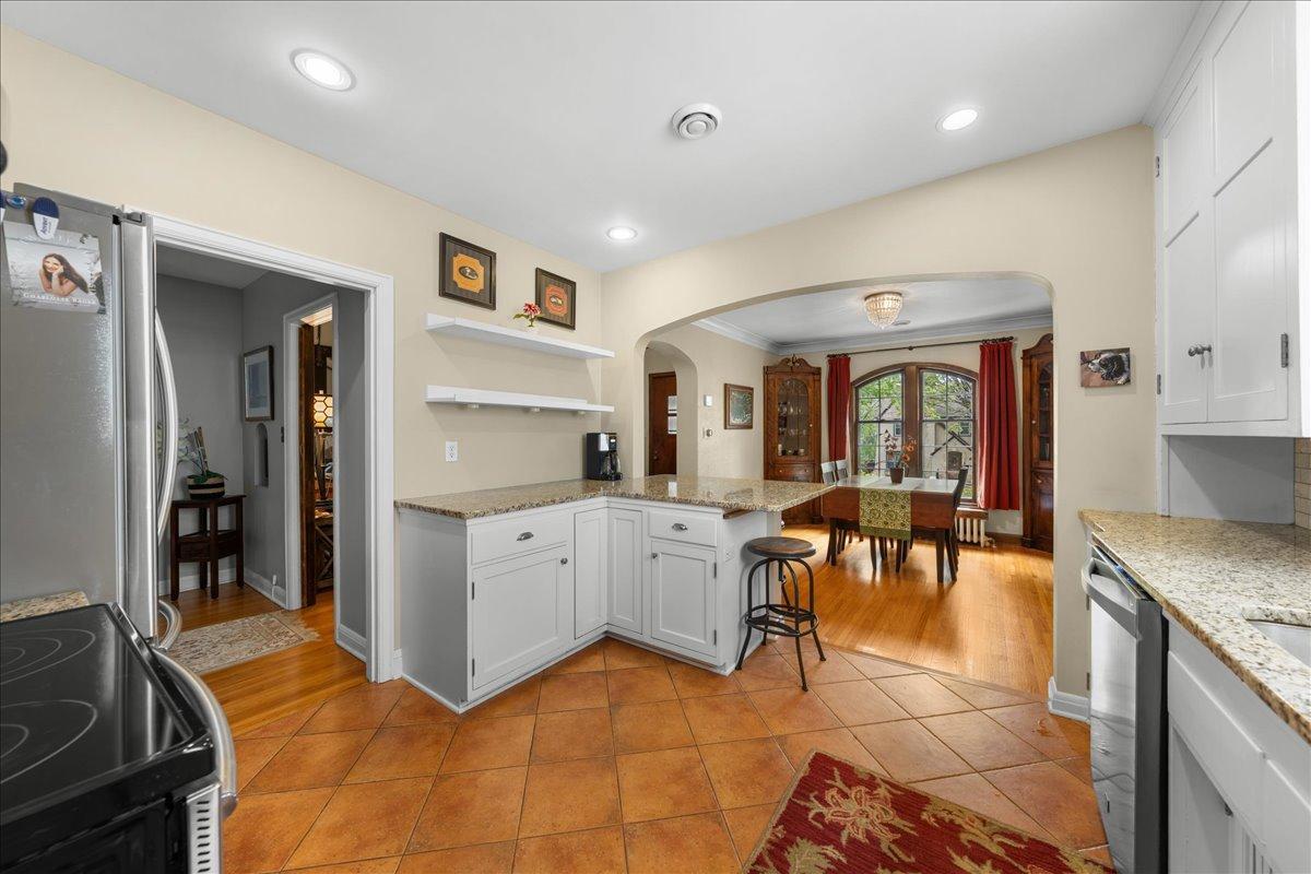 Graceful archway adding character and opening up the space for cohesive dining experience