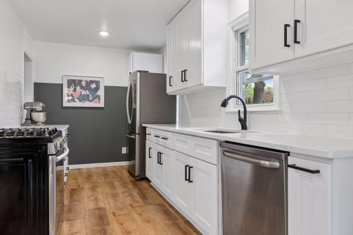 The Kitchen was remodeled with all new cabinetry, stainless steel appliances and quartz countertops.