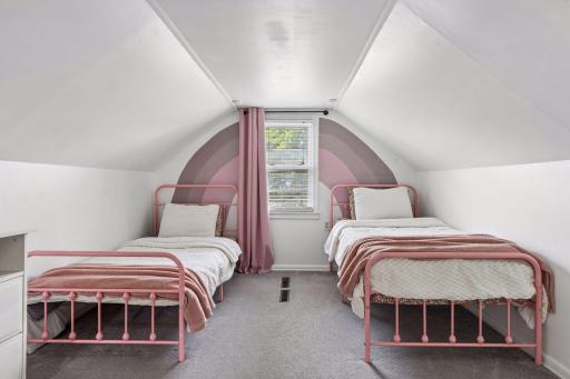 The upper level houses the third bedroom.