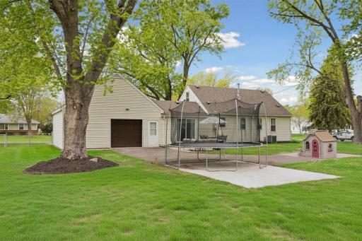 With concrete patios and a large, level lawn, there is plenty of room to play - there is even space for a basketball hoop.