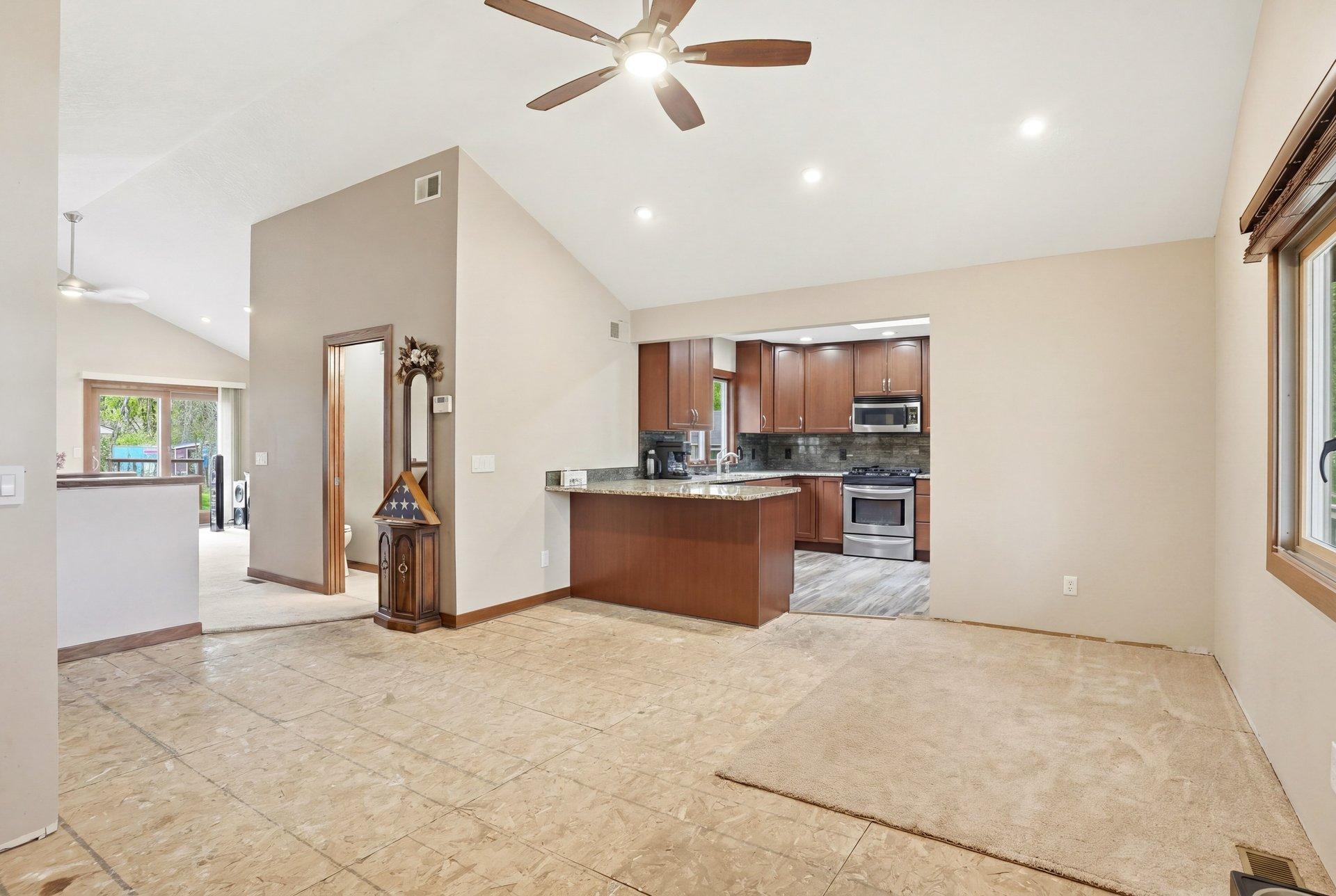 The spacious dining and entry area offers a fantastic opportunity for the next homeowner to personalize the space with the flooring option that best fits their style and vision!