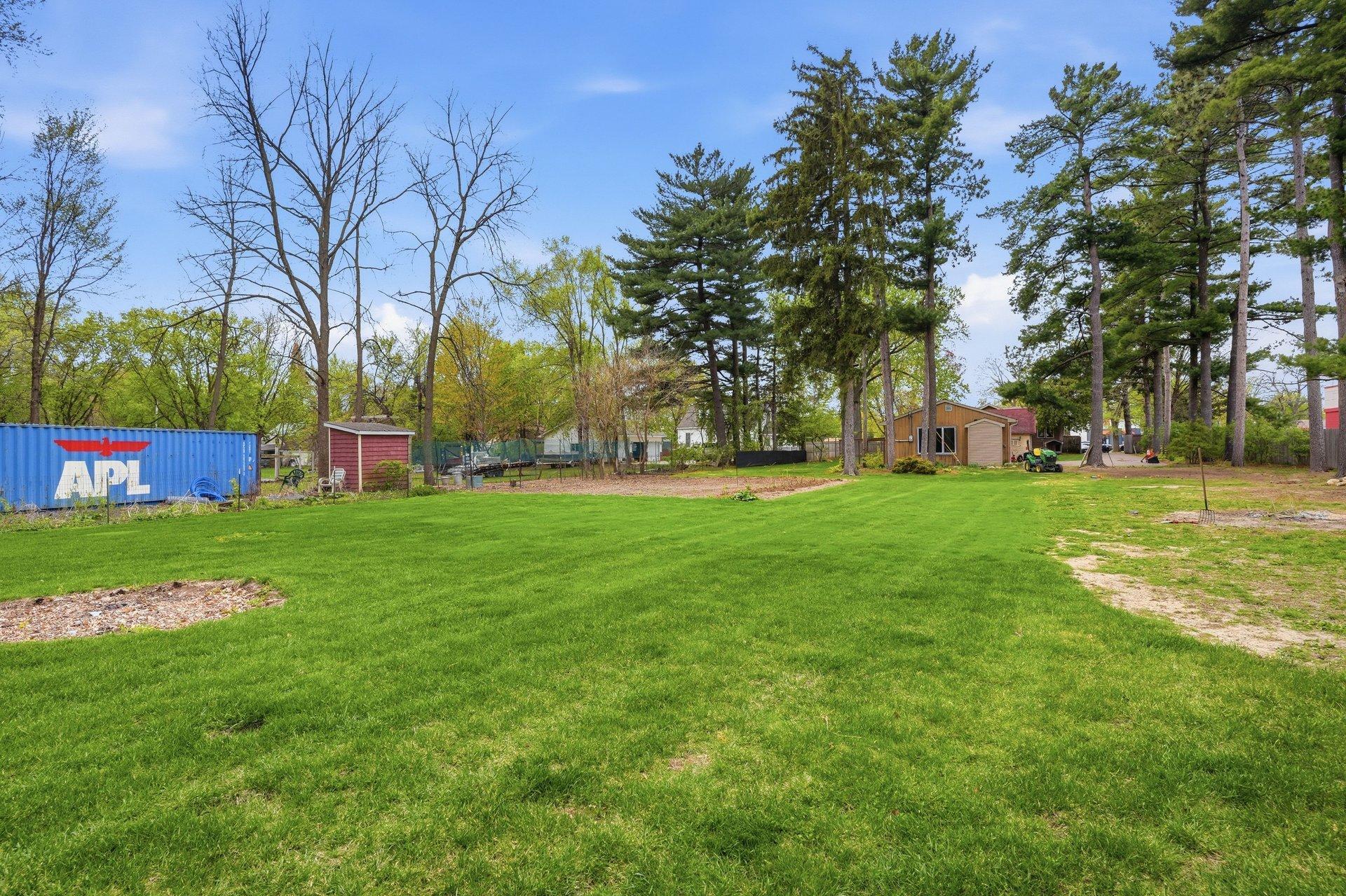 The grass is already turning a beautiful shade of green — summer is right around the corner and this backyard is ready to shine!