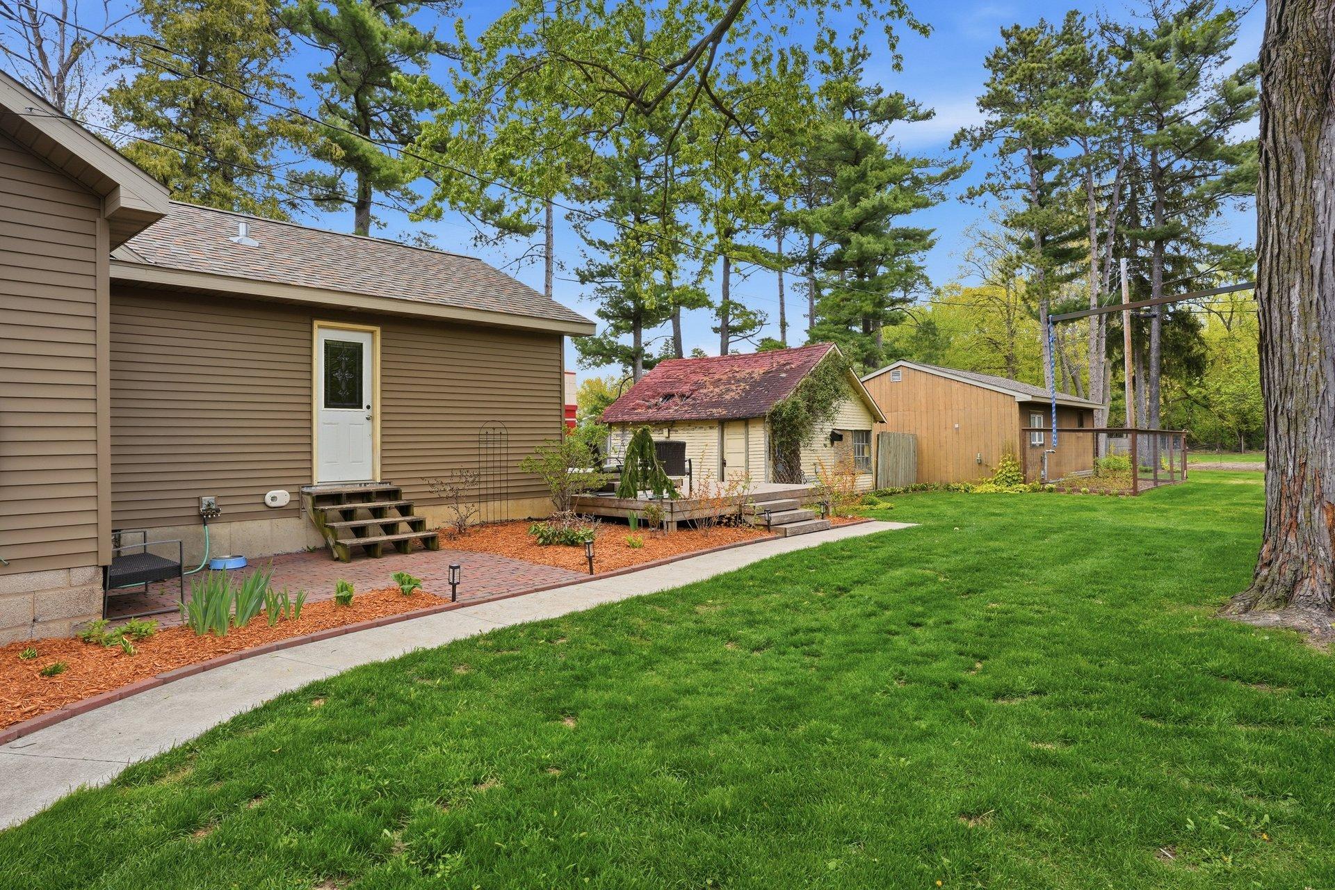 The grass is already turning a beautiful shade of green — summer is right around the corner and this backyard is ready to shine!