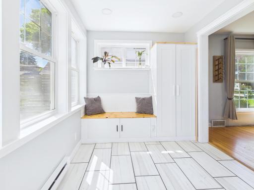 Main floor sunroom flexes as a mud room.
