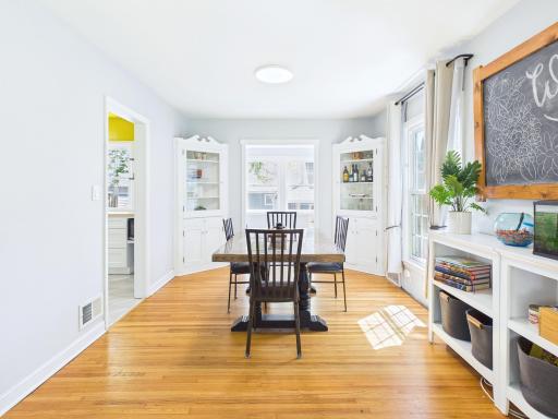 Formal dining room with built-in cabinets.