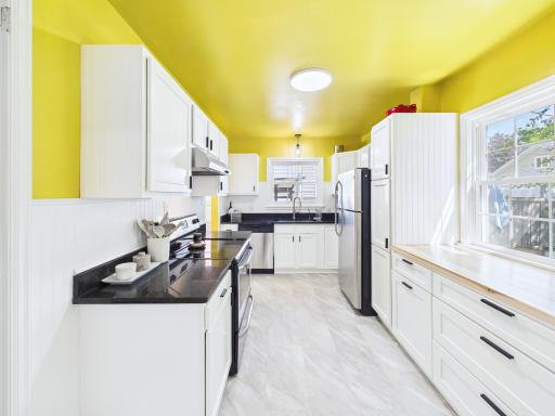 Renovated kitchen with plenty of counter space and storage.