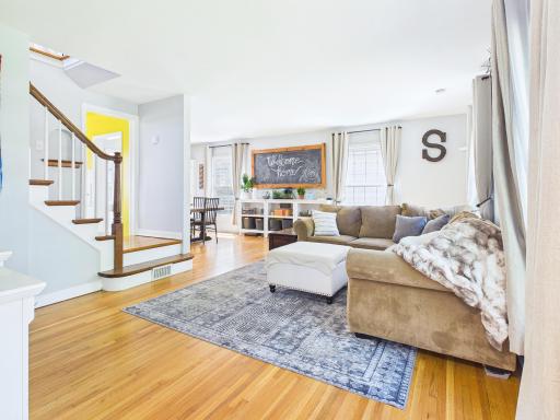 Open main level floor plan with hardwood floors and lots of natural light.