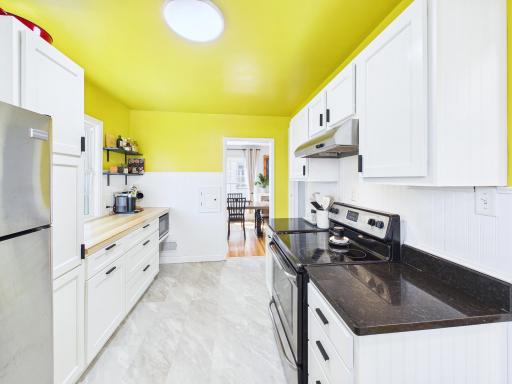 Stainless steel appliances, granite and butcher block countertops.