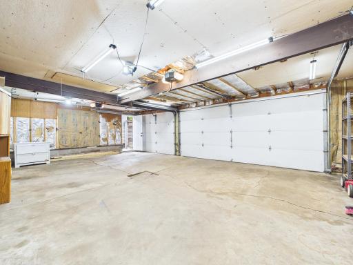Expansive 3-car garage made for those who like to fix, tinker, and play.