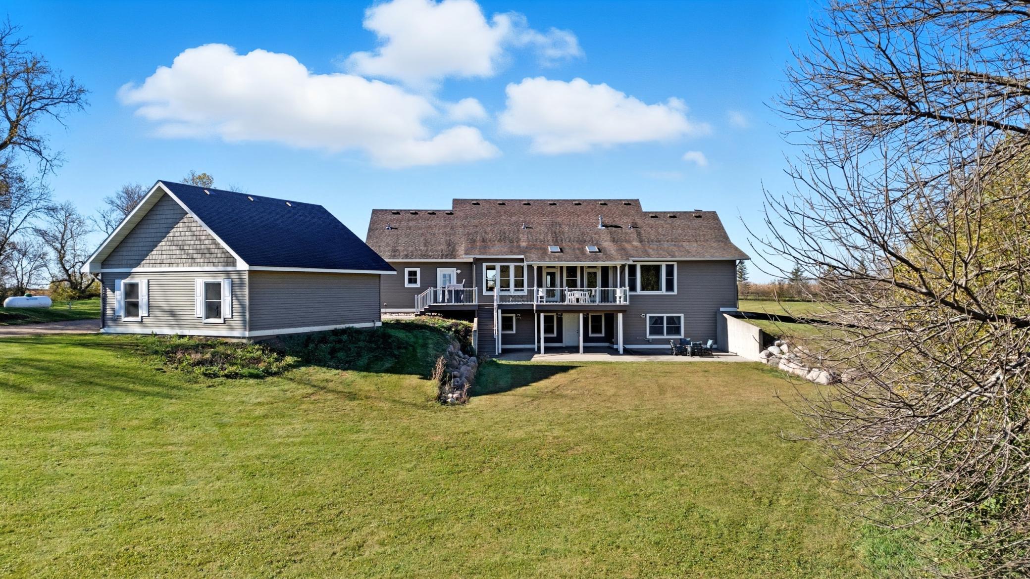 Rear view of house and garage