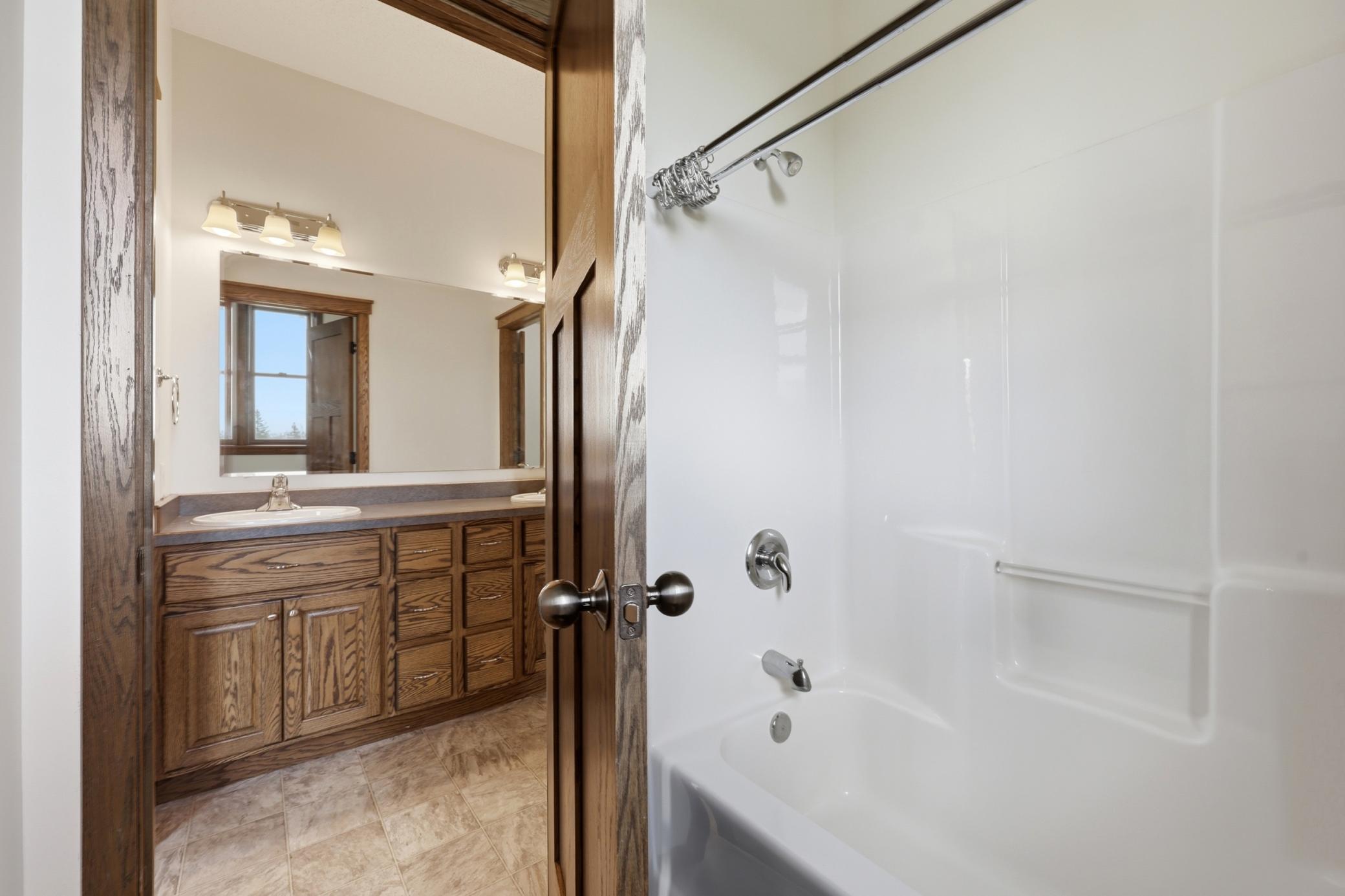 shared en-suite bath with double vanity between br 2 and br 3