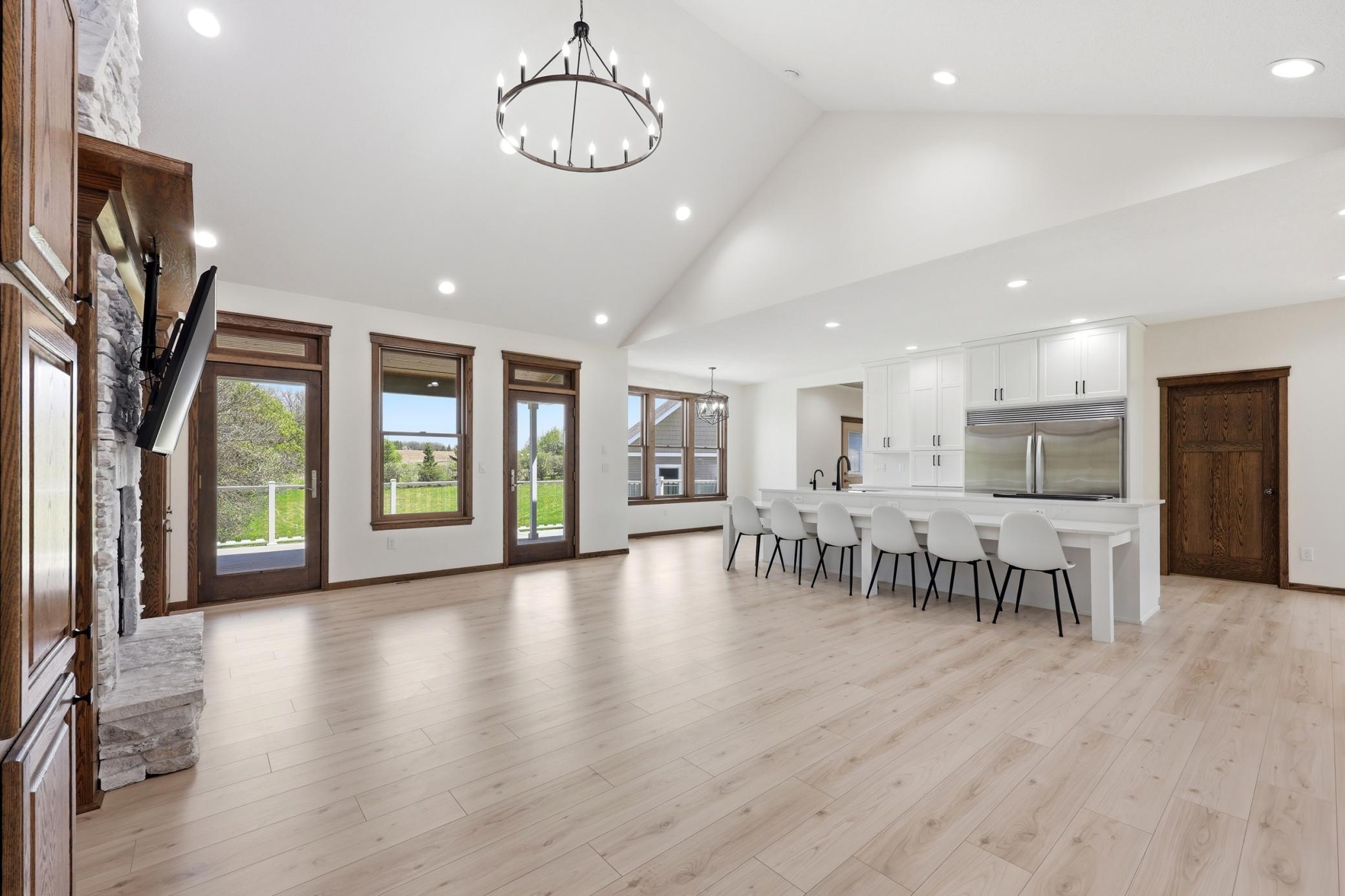 living room towards kitchen and deck access