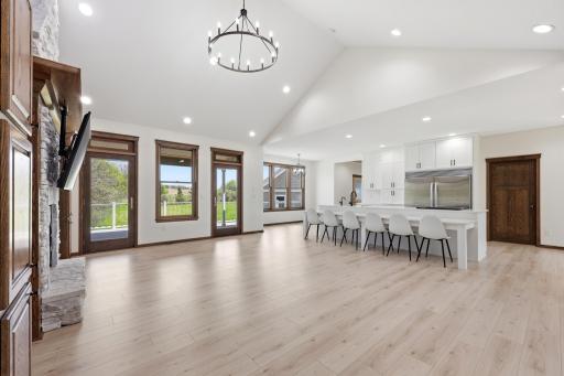 living room towards kitchen and deck access