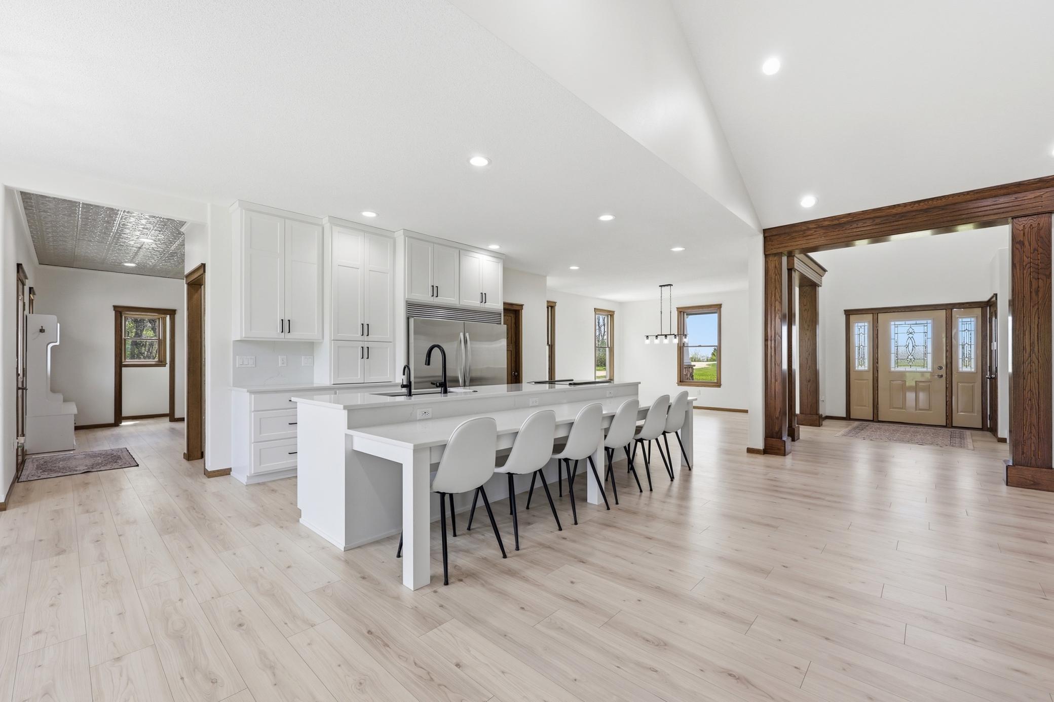 kitchen accesses rear mudroom/pantry/laundry to the left