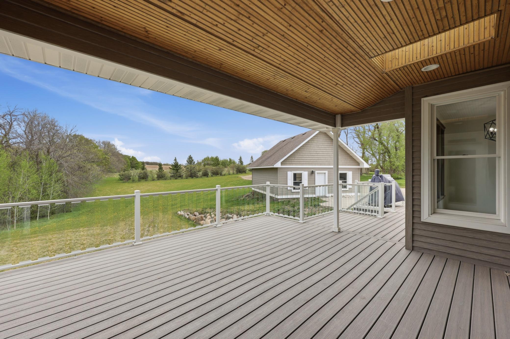 covered maintenance free deck w/ plexiglass rail