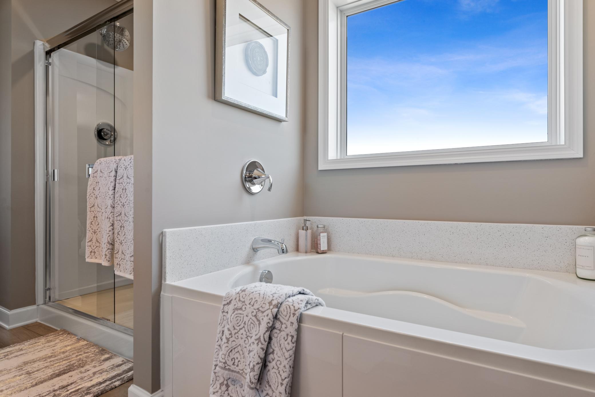(Photo of decorated model, actual home's finishes will vary) Another angle of the the owner's suite private bath!