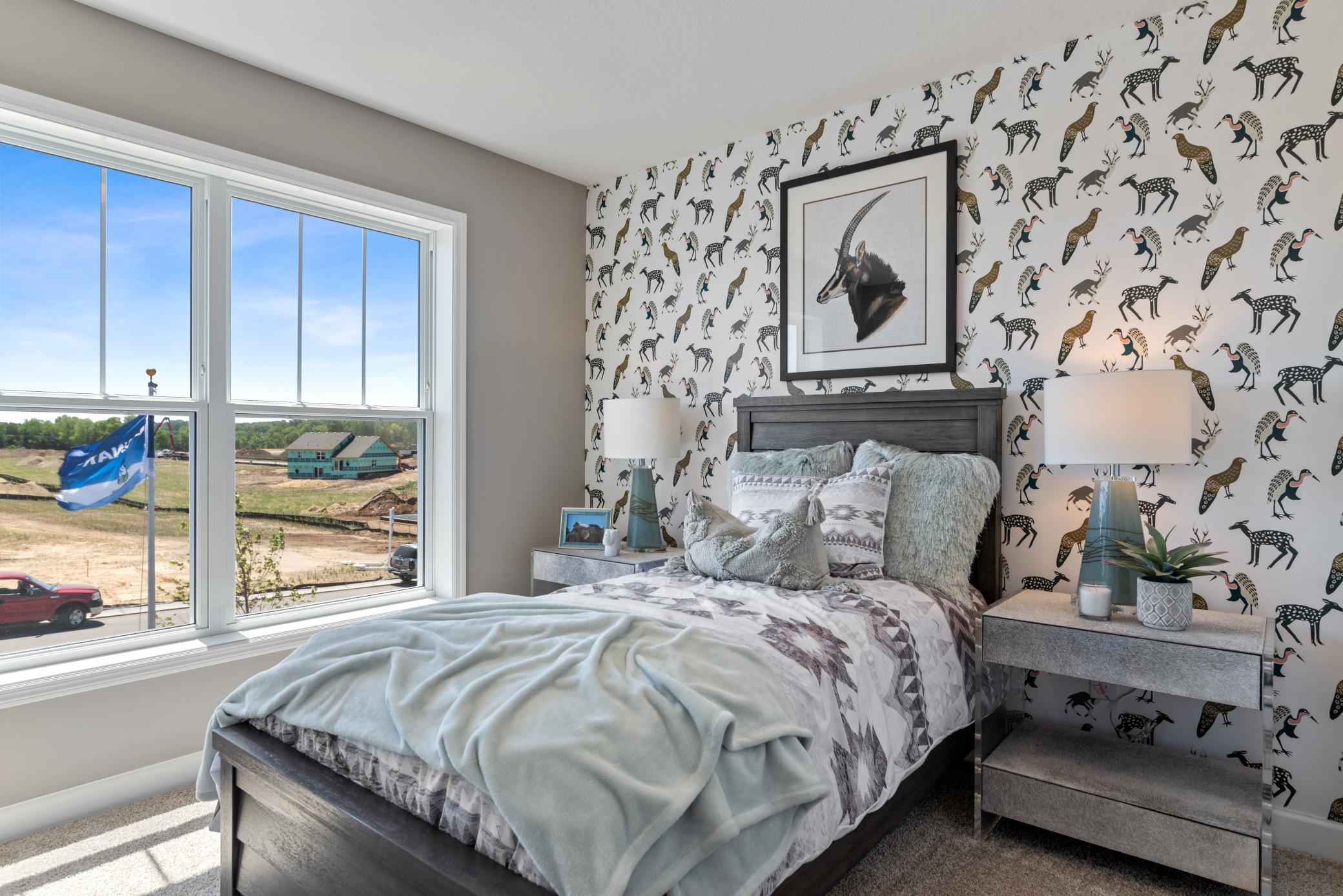 (Photo of decorated model, actual home's finishes will vary) The third spacious secondary bedrooms.