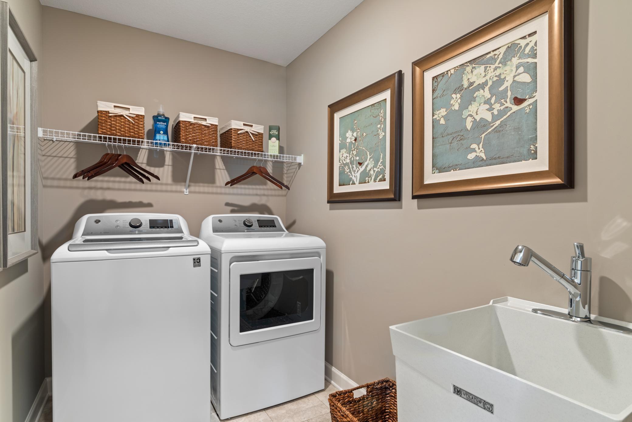 (Photo of decorated model, actual home's finishes will vary) Centrally located on the upper level, this laundry room provides the ultimate convenience.