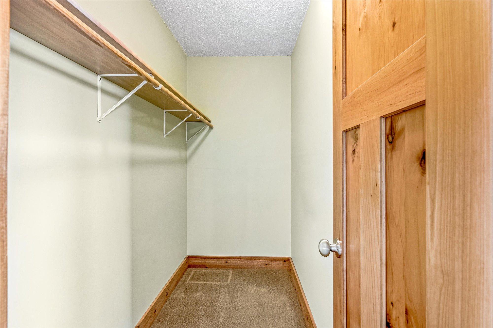 Primary bedroom walk in closet.