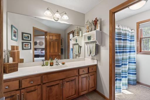 The full shared bath upstairs features a clever pocket door separating the sink area from the shower and toilet makes it easy for multiple people to use the space at the same time. A thoughtful feature that keeps the morning routine running smoothly