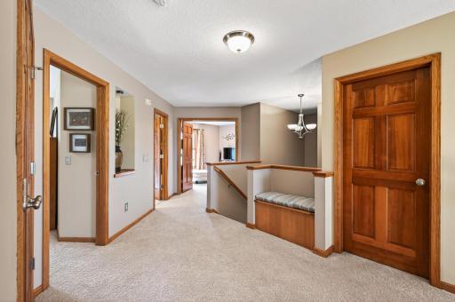 Upstairs you'll find a large landing area with a generous linen closet. In addition to the primary suite, there are three additional bedrooms, each with their own walk-in closet, plus a shared bath.