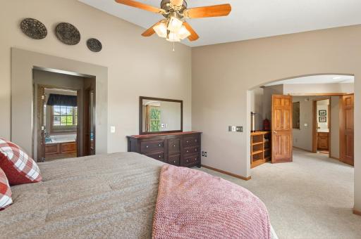 With vaulted ceilings and two generous closets, the primary suite is a true personal escape.