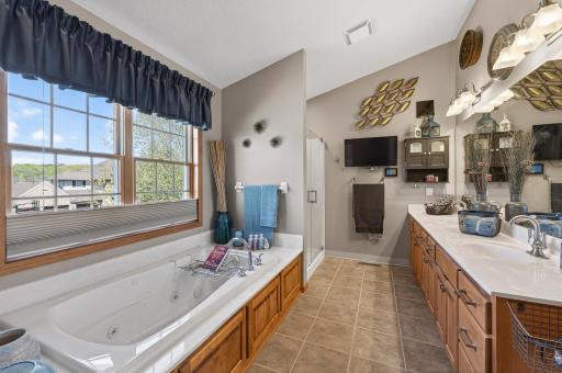 With a Jacuzzi jetted tub and a walk-in shower featuring a glass door, the primary bath delivers a full spa experience right at home. No membership required.