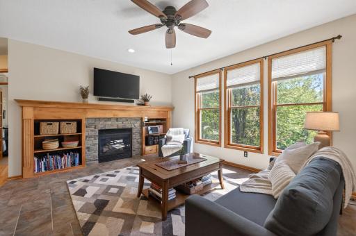 Relax by the cozy gas fireplace while enjoying a front row seat to the beauty of nature, with wildlife frequently visiting just outside your windows.