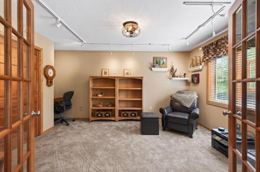 The lower level also offers a fifth bedroom with French doors, wired for networking and printers, making it just as well-suited as a private home office or flex space depending on your needs.