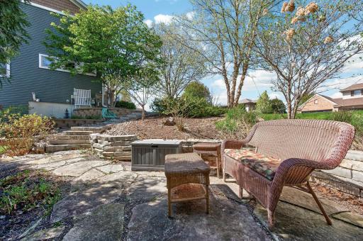 Tucked away and all your own, this hidden outdoor sitting area is the perfect place to slow down, soak in the surroundings, and watch your gardens grow.
