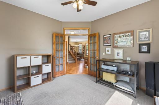The dedicated home office is perfectly set up for working from home, featuring elegant French doors and a centrally located communications/data hub that keeps everything connected and organized.