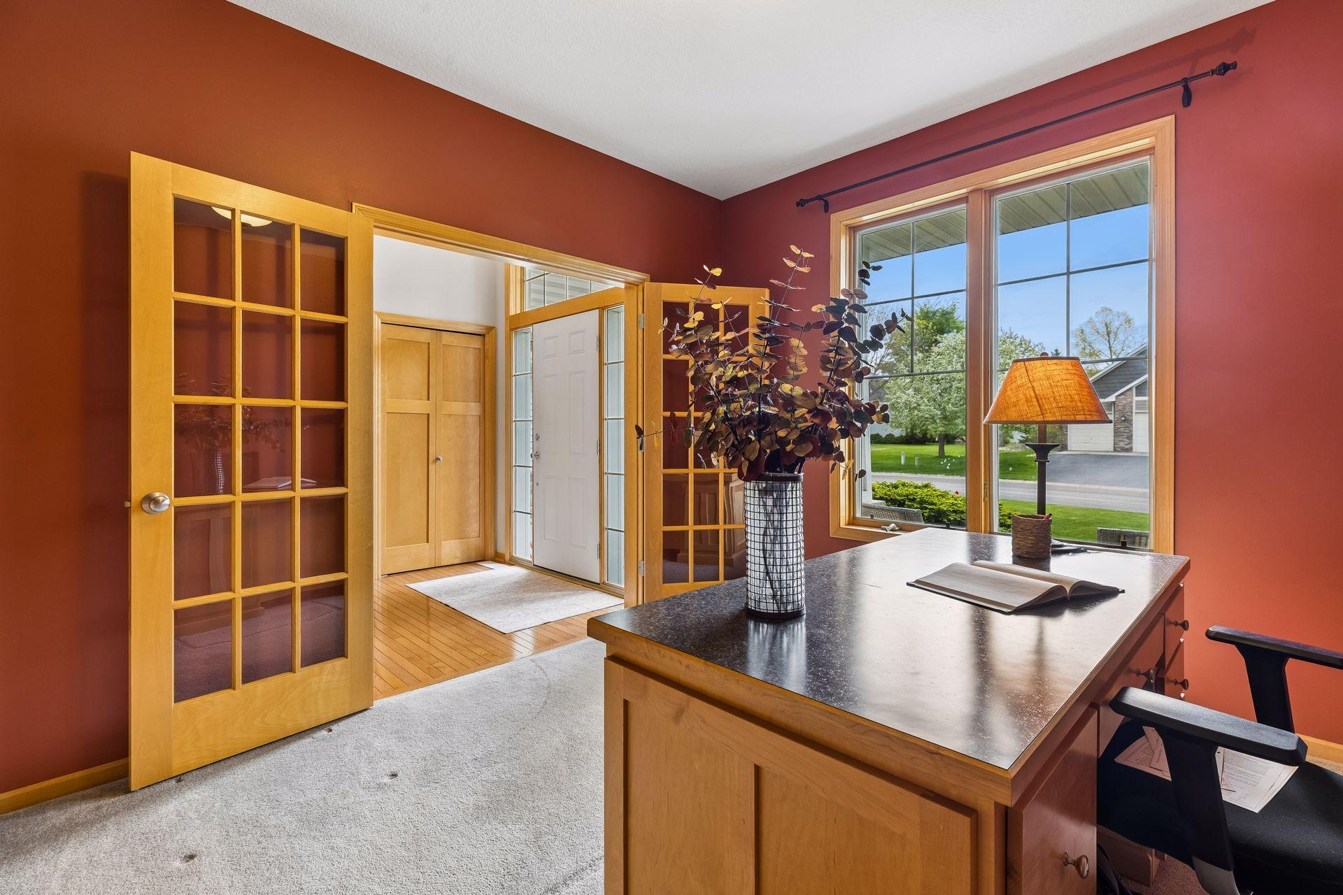 Private office with French Door boasts custom maple cabinets and desk