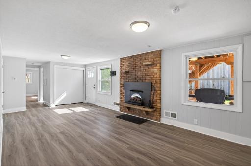 Lower level family room with electric fireplace and walkout to backyard