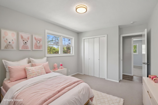 Virtually staged 2nd of three main floor bedrooms