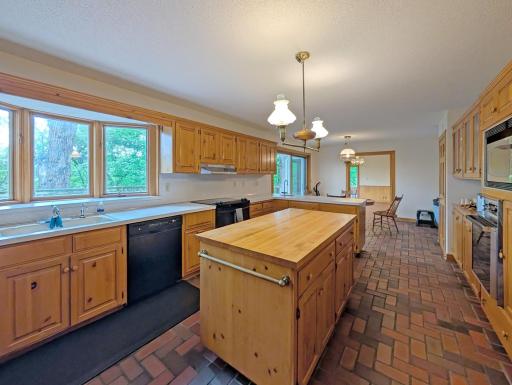 Center island kitchen with loads of cabinetry.