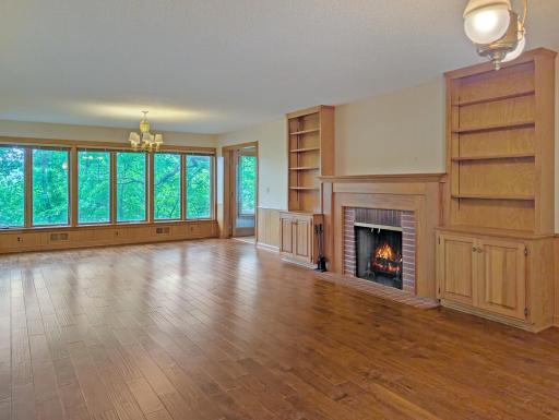 Huge main floor great room has windows with natural views.