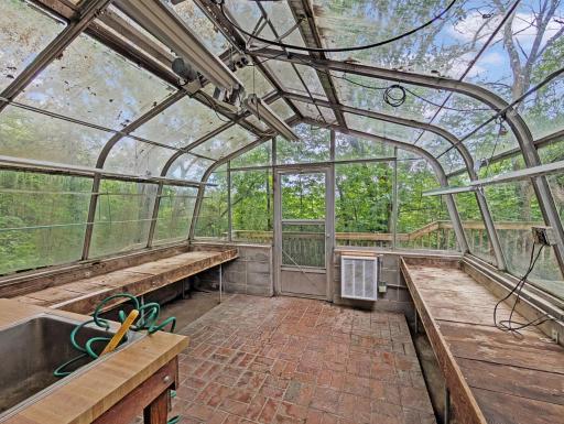 Greenhouse off the mudroom is set up for year round growing.