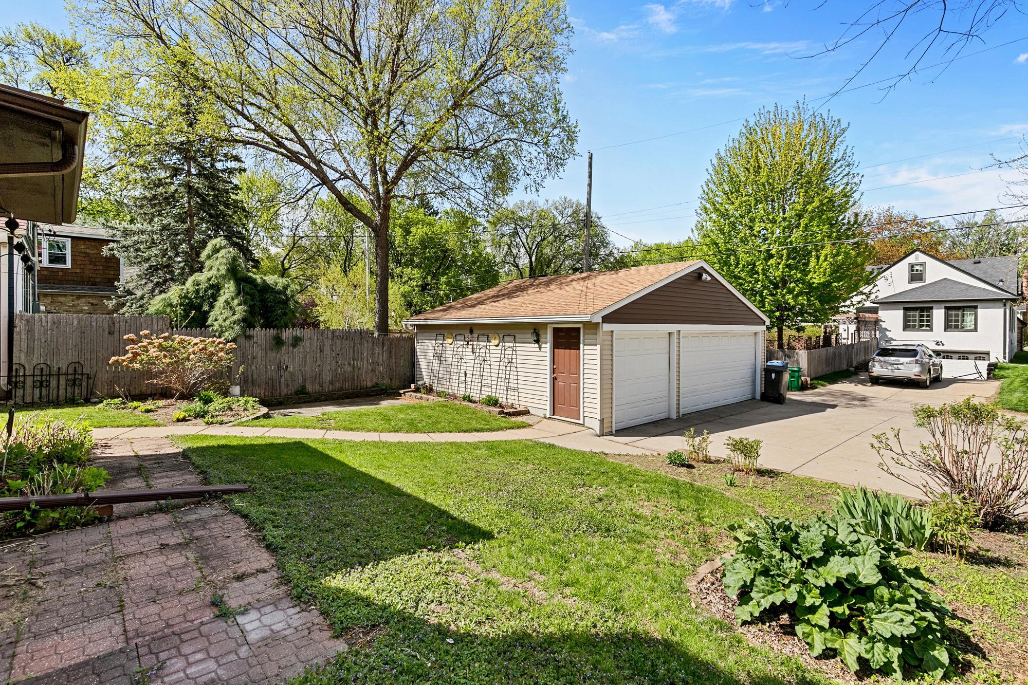 3 car garage , 2 patios & garden !